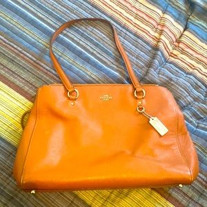 Gently used tan coach over the shoulder purse